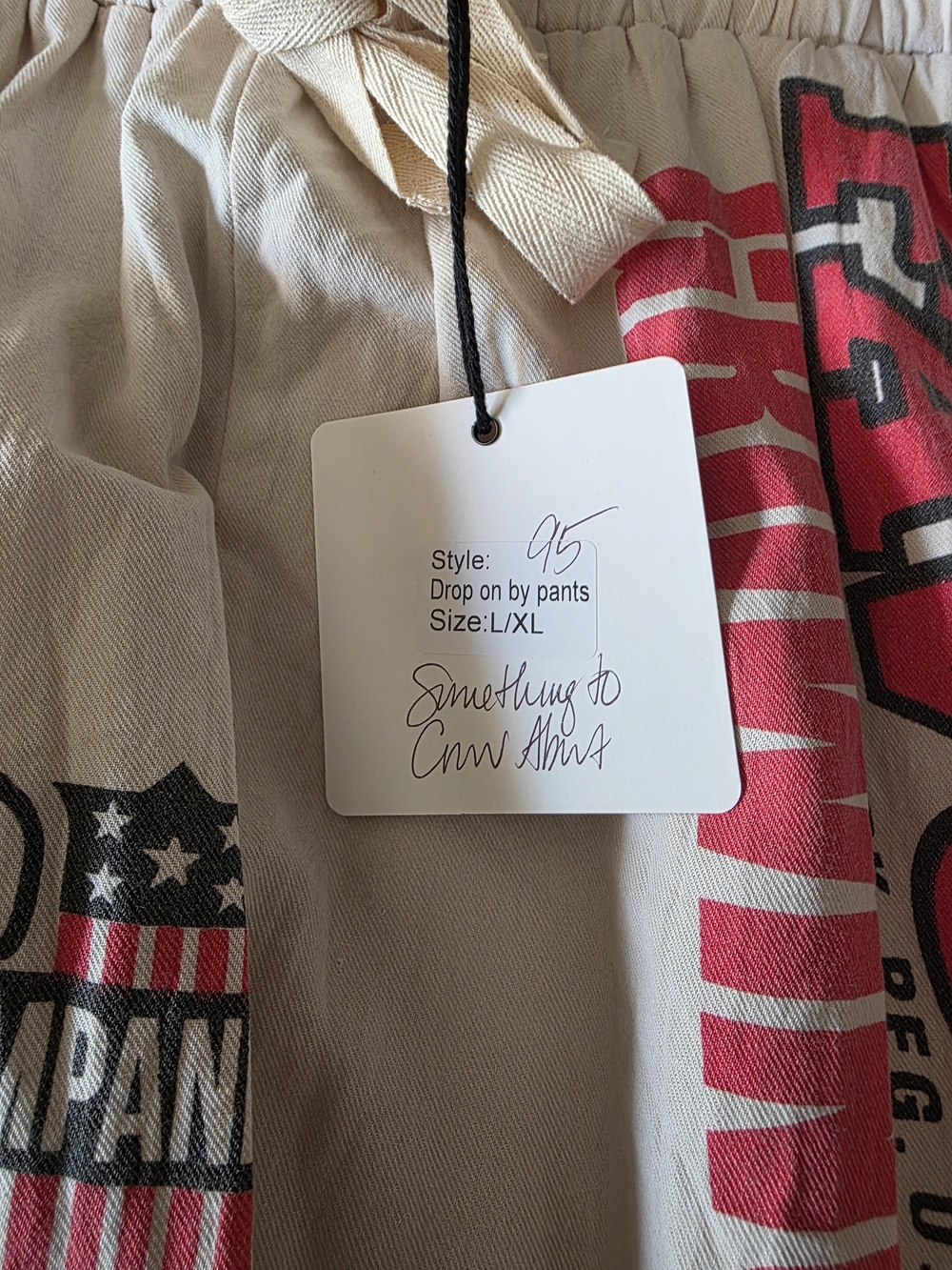 Drop On By Pants. Cream and Red Graphic Cropped - Picture 4 of 4